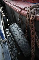 A tractor tyre shields us from the honking great chain