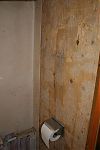 Captain's Cabin toilet wall stripped bare