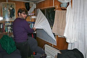 James pulling the paper off the plexiglass